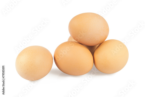 Five chicken eggs on a white background