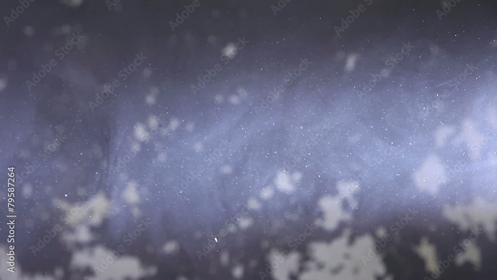 background of purple dust particles and smoke in slow motion background of purple dust particles and smoke in slow motion