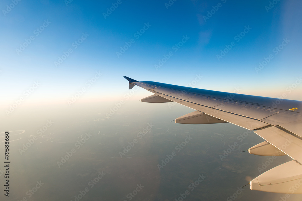 Airplane wing out of window Airplane wing out of window