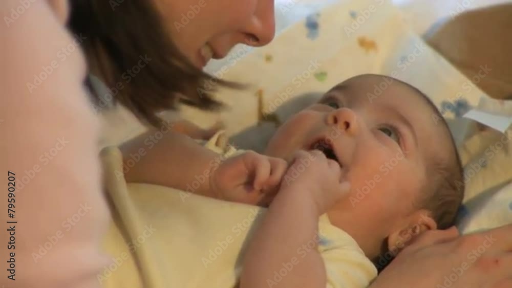 Shots of an infant with it's mother Shots of an infant with it's mother