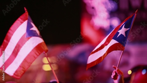 Two Puerto Rican Flags being held at Festival