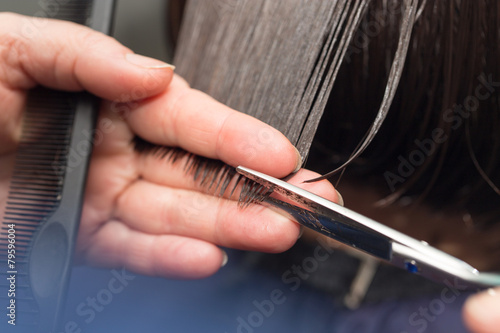 Leinwand Poster cutting hair in a beauty salon