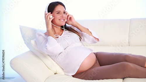beautiful future mum listening music