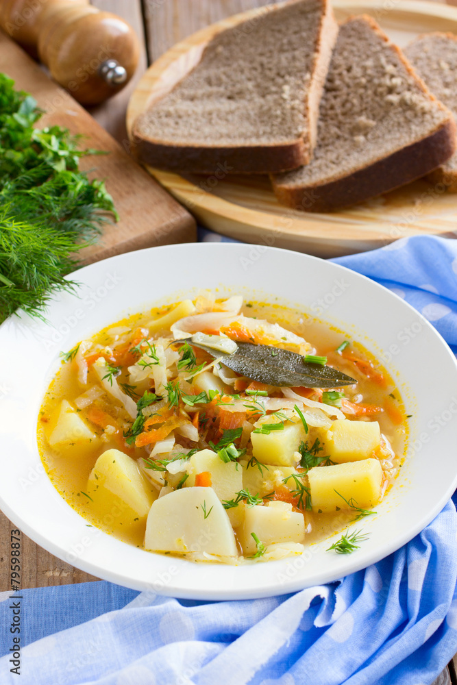 Traditional Russian cabbage soup with proso millet and potato Traditional Russian cabbage soup with proso millet and potato