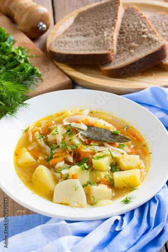 Traditional Russian cabbage soup with proso millet and potato
