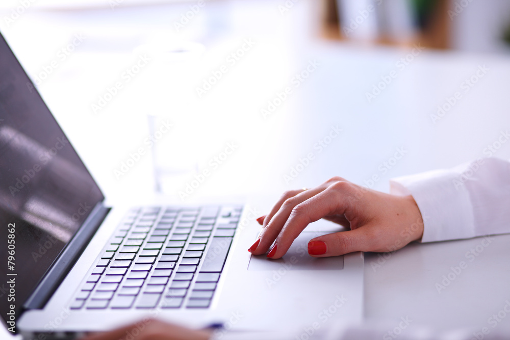Young businesswoman working on a laptop Young businesswoman working on a laptop