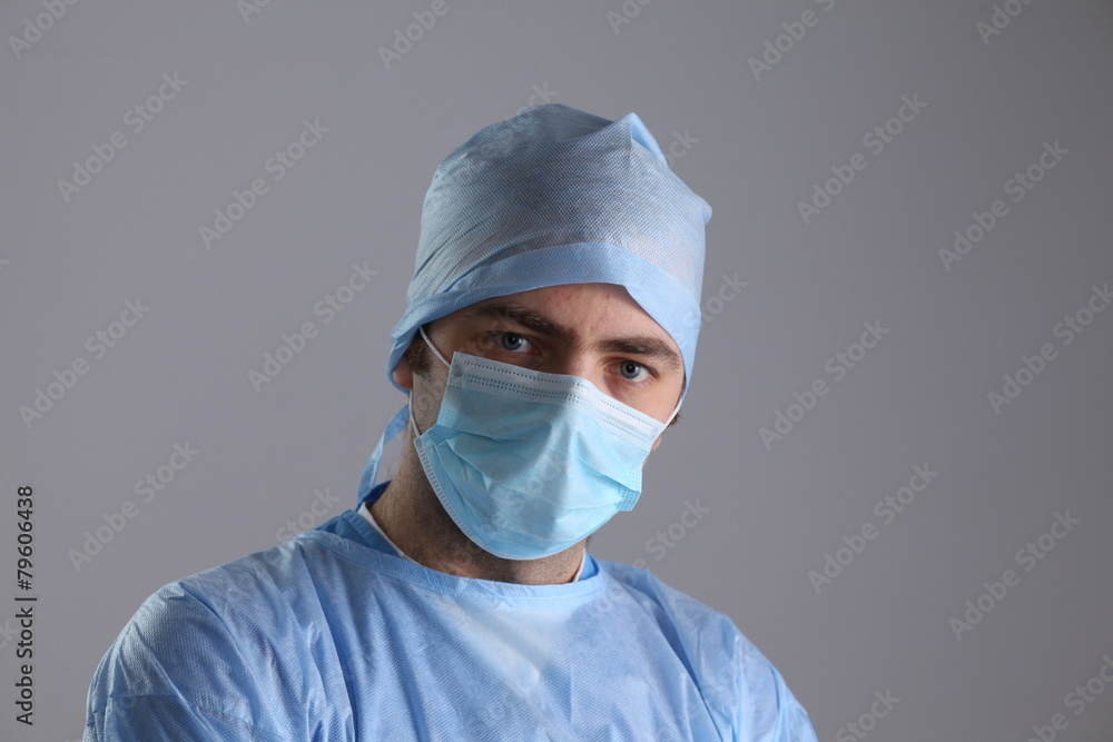 Man surgeon holds a scalpel in an operating room Man surgeon holds a scalpel in an operating room