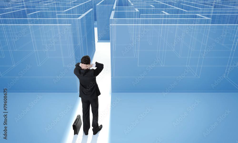 Businessman standing in front of entrance to maze. Businessman standing in front of entrance to maze.
