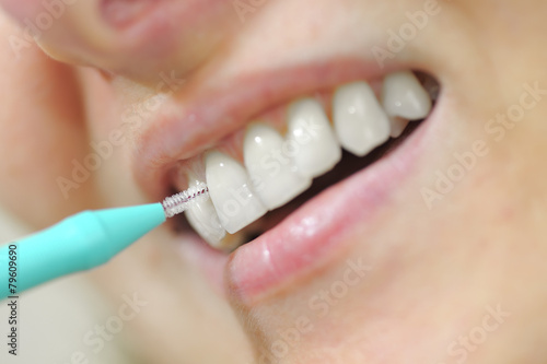 woman using an interdental brush