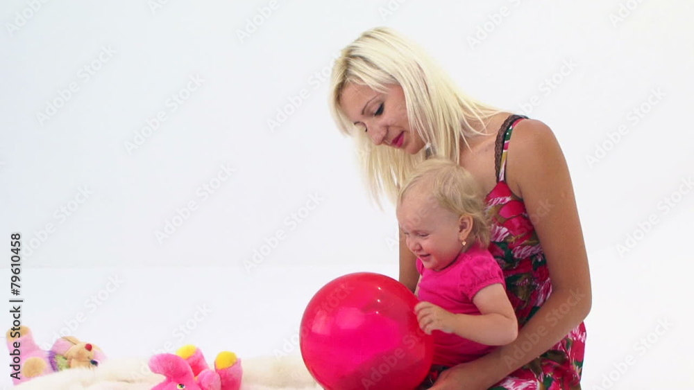 Mother And Her Baby Playing With Pink Balloon Mother And Her Baby Playing With Pink Balloon
