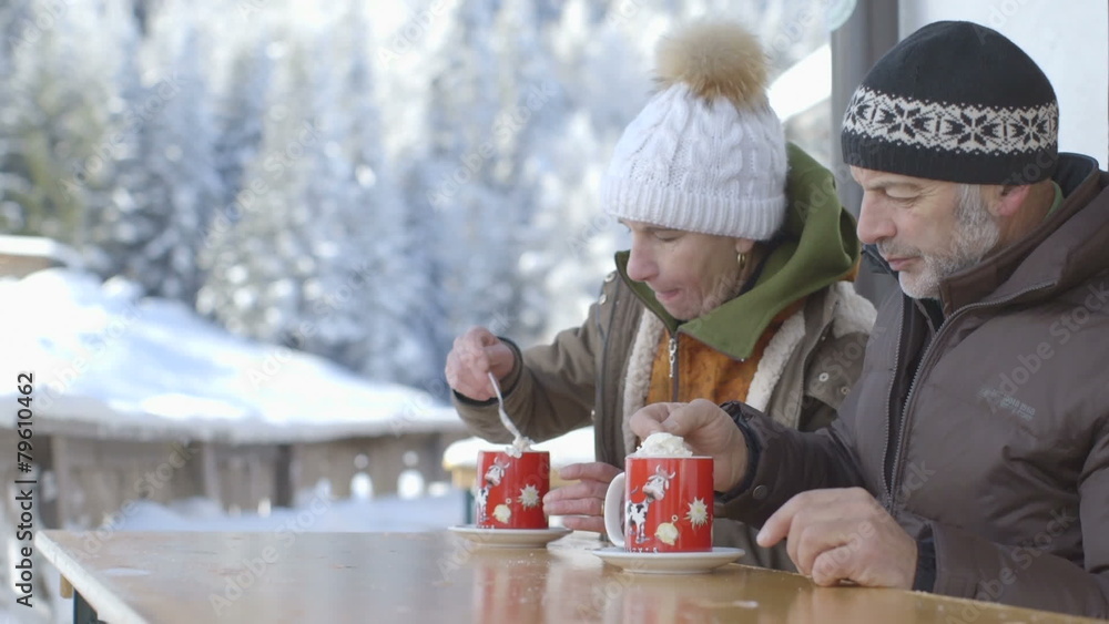 Senior couple enjoying hot chocolate during winter Senior couple enjoying hot chocolate during winter
