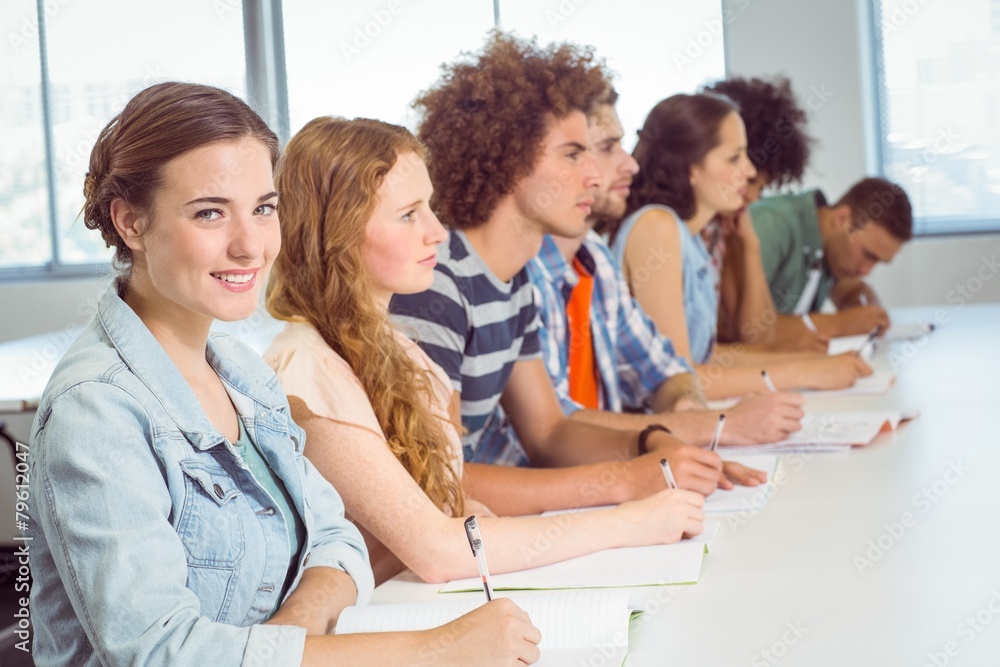 Fototapeta premium Fashion students taking notes in class