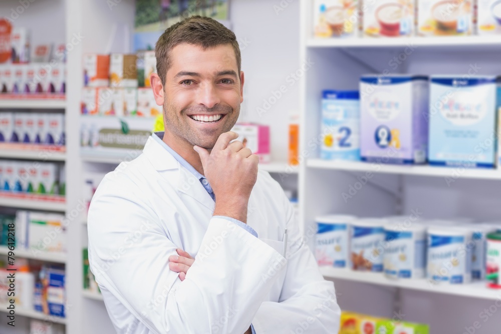 Handsome pharmacist smiling at camera Handsome pharmacist smiling at camera