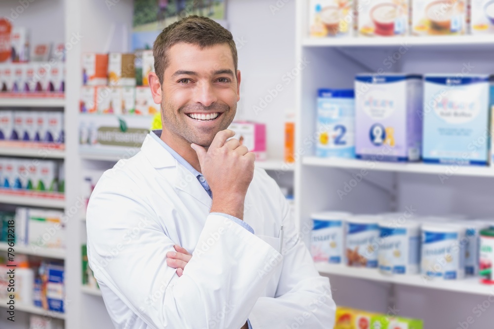 Handsome pharmacist smiling at camera