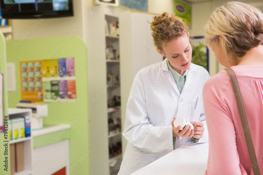 Pharmacist and her customer talking about medication Pharmacist and her customer talking about medication