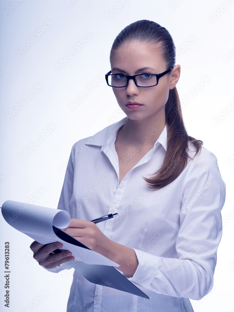 Portrait of a woman writing notes