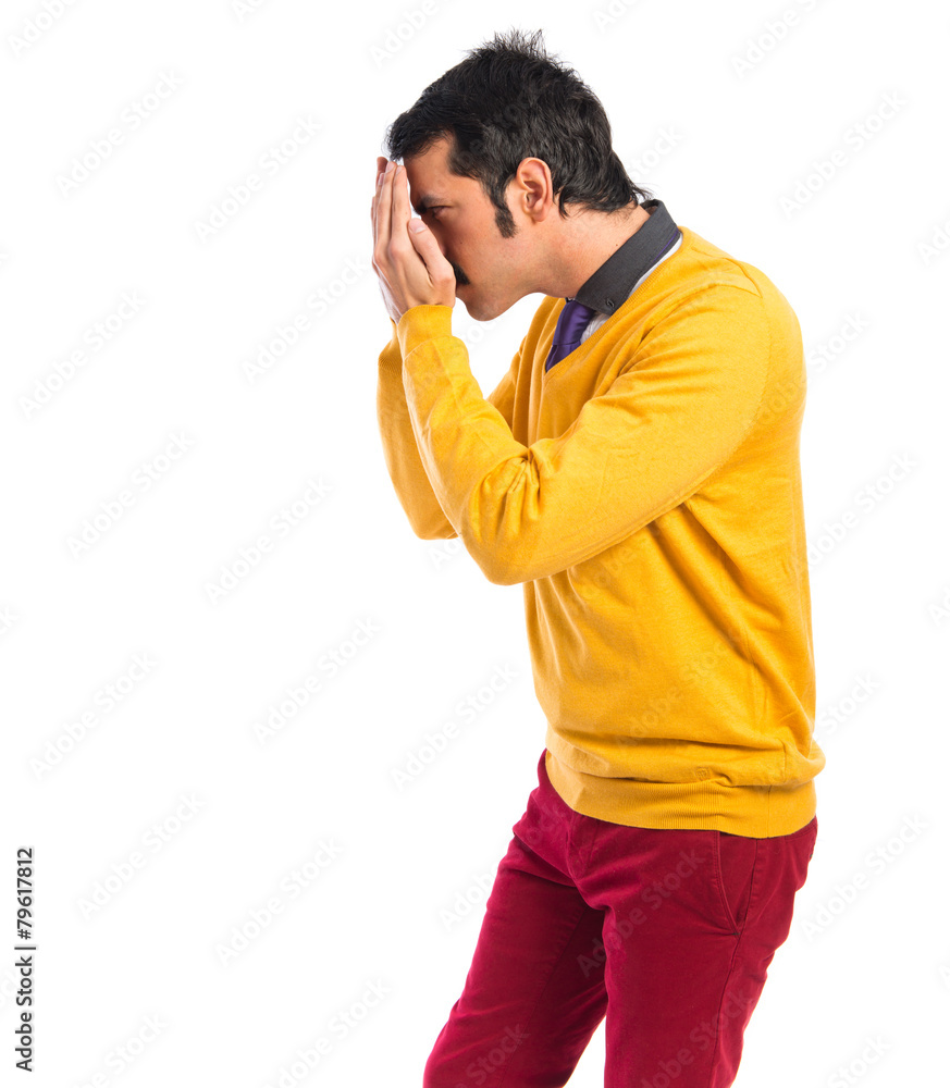 Man covering his eyes Man covering his eyes