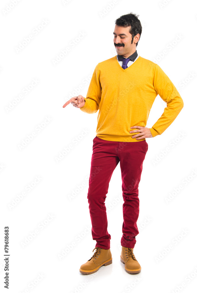 Man with moustache pointing something Man with moustache pointing something