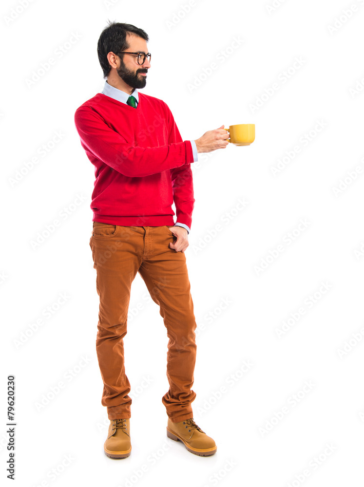 Hipster man holding a cup of coffee Hipster man holding a cup of coffee