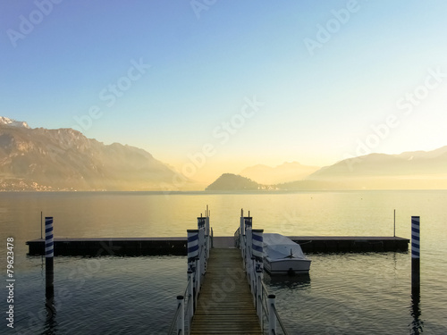Small pier in Menaggio, on the lake of Como, during the sunset