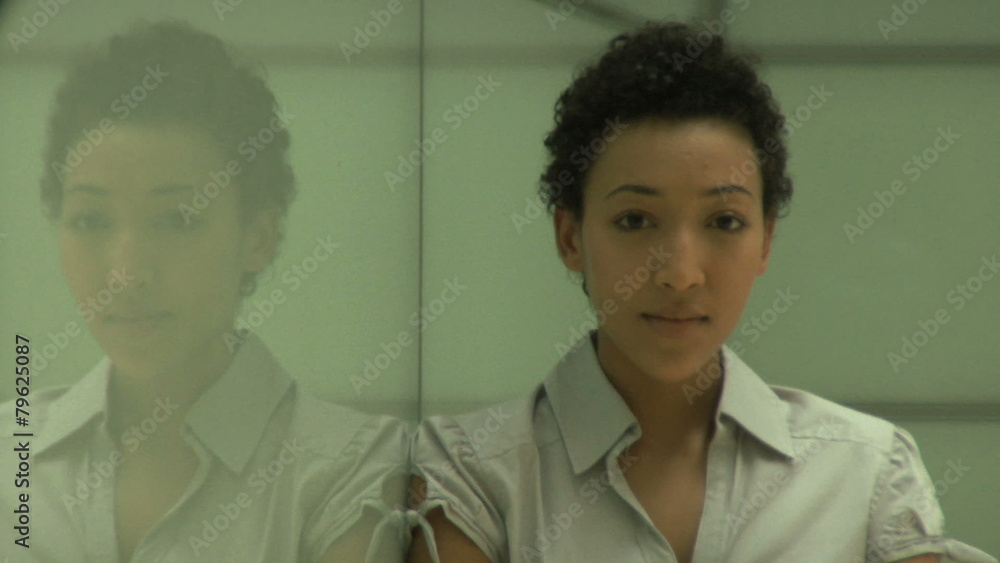 MS FEMALE IN OFFICE TURNING TO CAMERA PORTRAIT MS FEMALE IN OFFICE TURNING TO CAMERA PORTRAIT