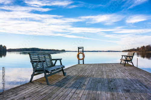 jetty with benches at the lake © nakimori