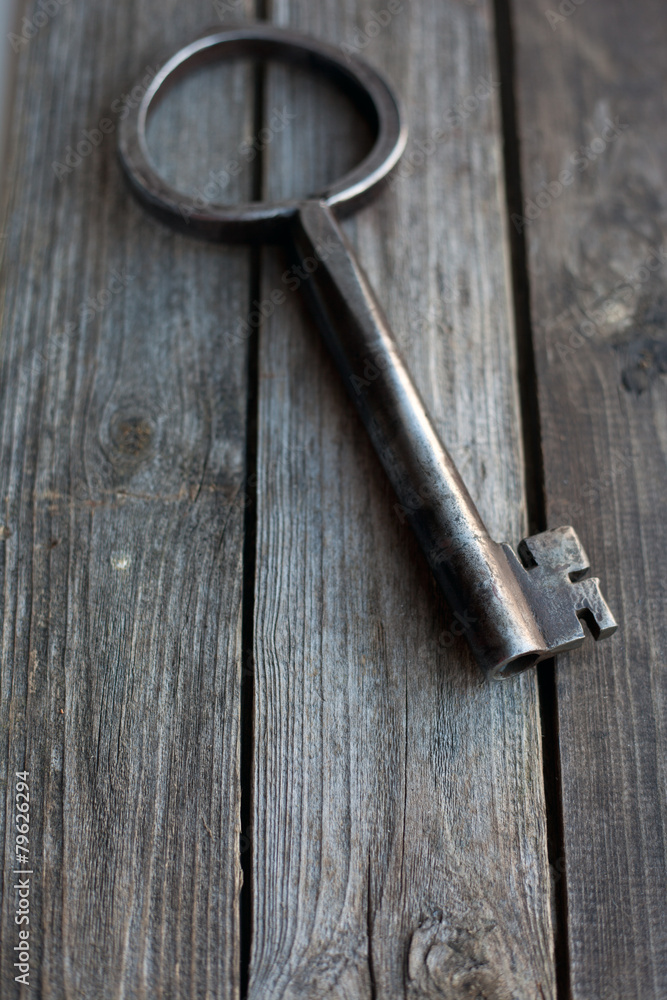 big key on wooden rustic table big key on wooden rustic table