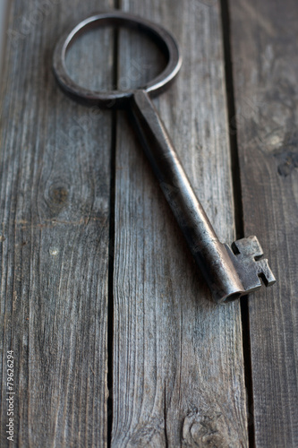 big key on wooden rustic table © blue_caterpillar