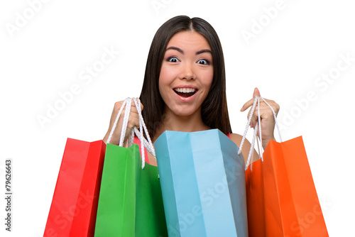 Asian surprised woman after shopping with bags