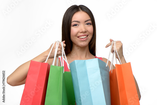 Asian happy woman after shopping with bags