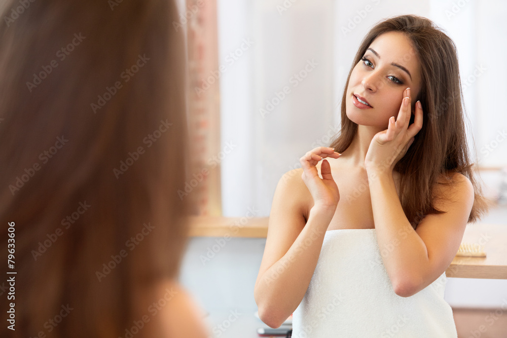 Fototapeta premium Spa Woman. Beautiful Girl Touching Her Face. Perfect Skin. Skinc