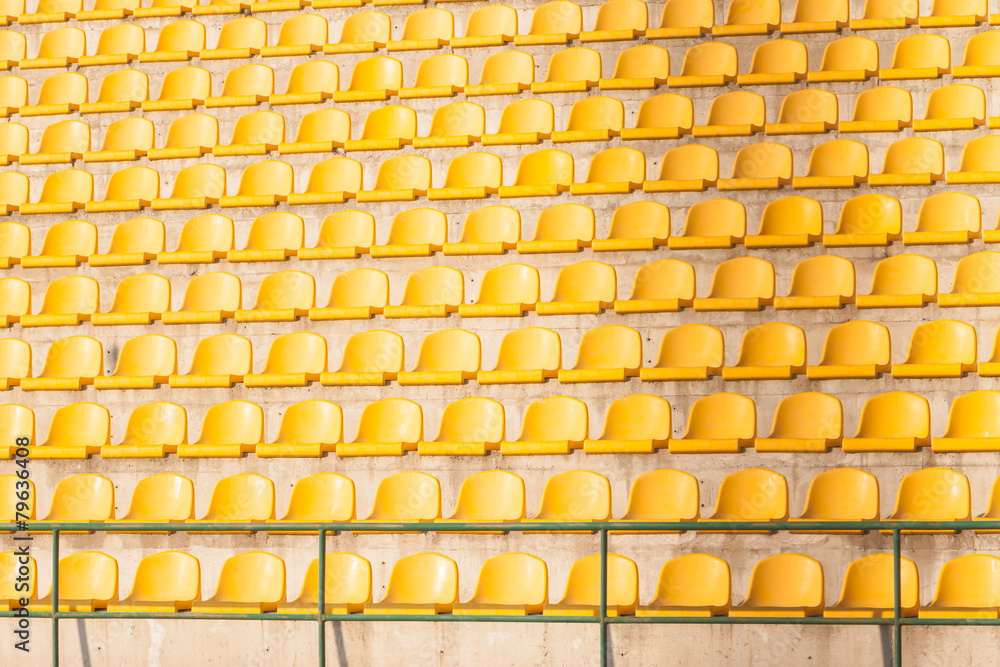Fototapeta premium yellow chairs on the soccer field