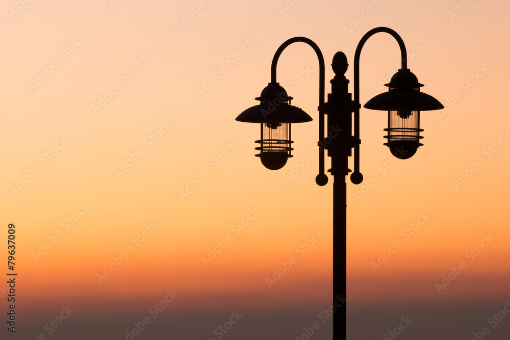 silhouette lamp on sunset background silhouette lamp on sunset background