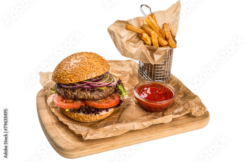 Restourant serving dish - burger with meat, frying potato on woo