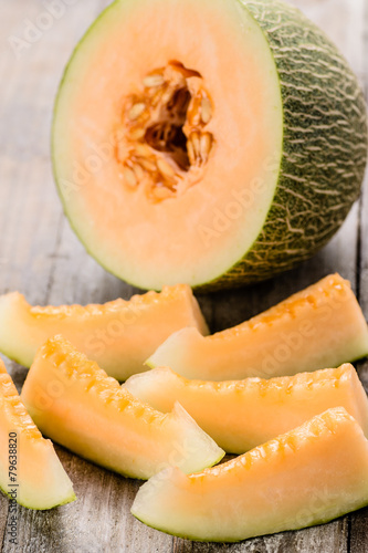 melon pieces on the wooden board