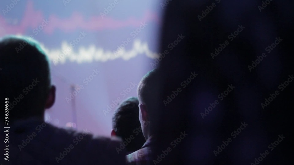 young guys dancing in a concert in a music club young guys dancing in a concert in a music club