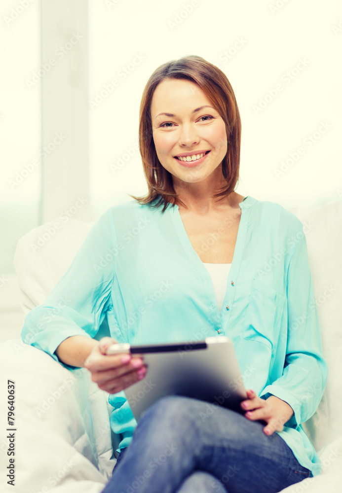 smiling woman with tablet pc computer at home smiling woman with tablet pc computer at home
