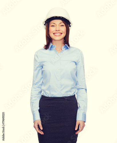 young smiling businesswoman in white helmet