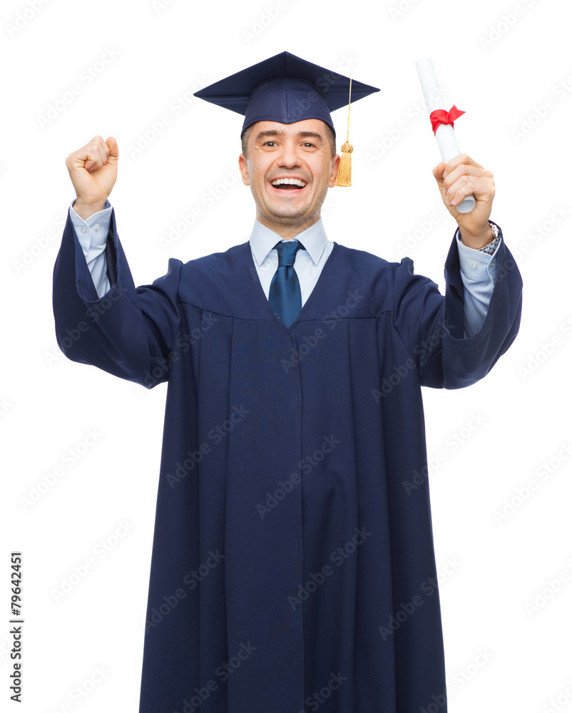 smiling adult student in mortarboard with diploma smiling adult student in mortarboard with diploma