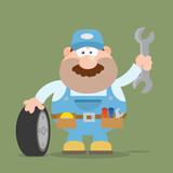 Smiling Mechanic Cartoon Character With Tire And Huge Wrench