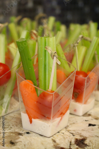 Vegetables and dipping sauce in individual cups