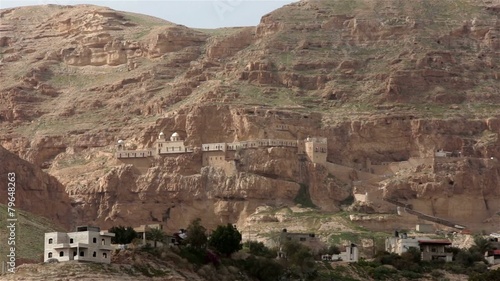 Monastery of the Temptation located in rocks of mountains - photo