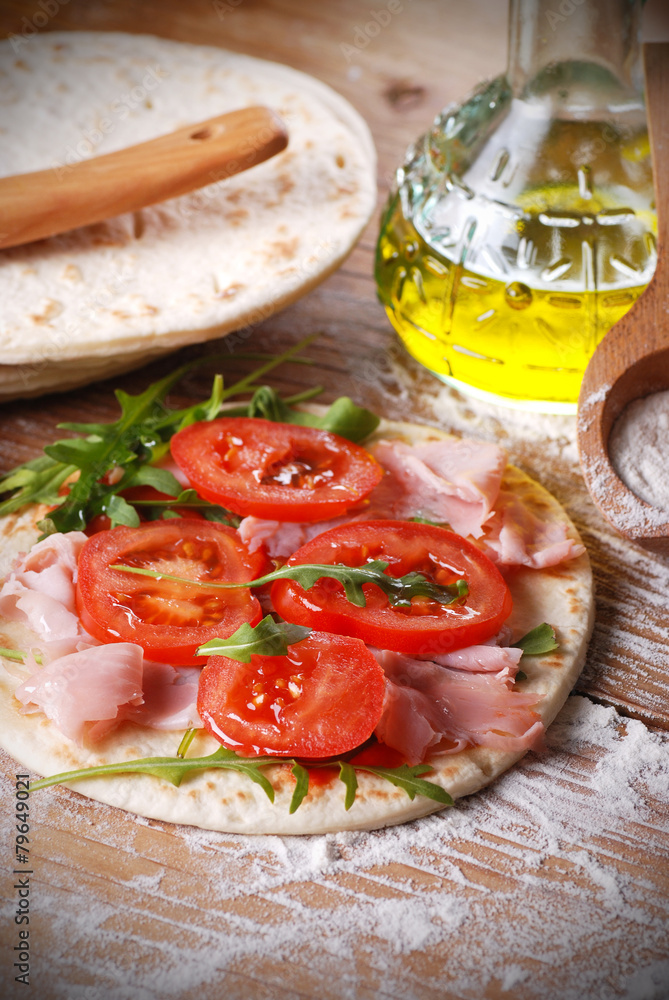 piadina romagnola con pomodoro, prosciutto e rucola Stock Photo Adobe