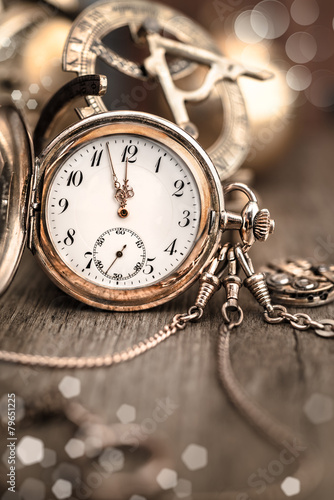 Vintage watch on abstract vintage background showing five to twe