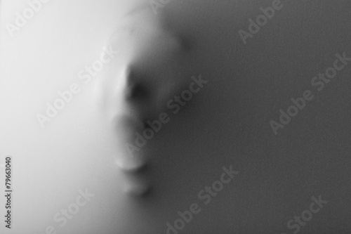 Bilde på lerret Screaming human face pressing through fabric as horror
