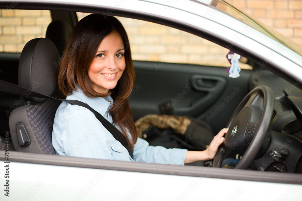 young woman driving her car
