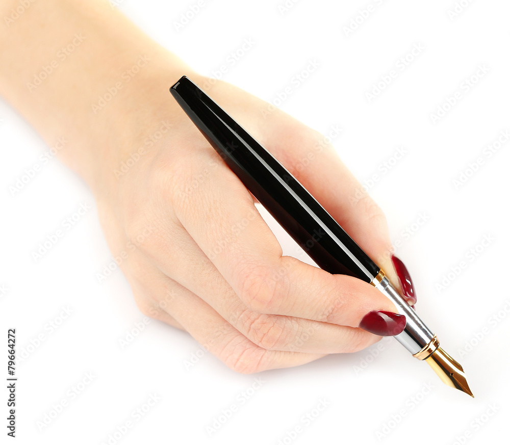 Fountain pen in female hand isolated on white Fountain pen in female hand isolated on white