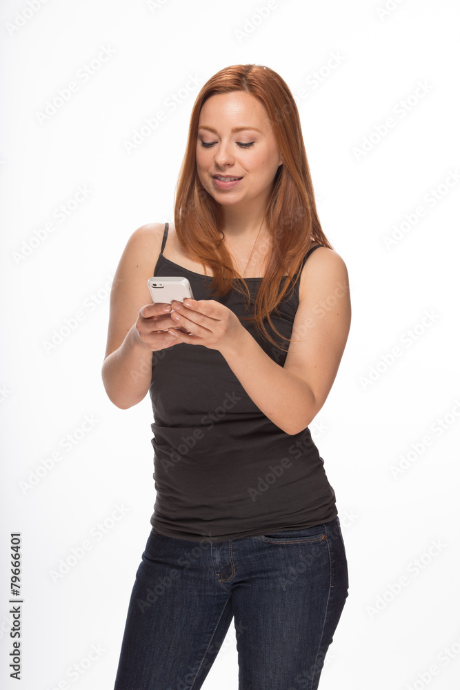Fototapeta premium Young Caucasian woman texting on smart phone