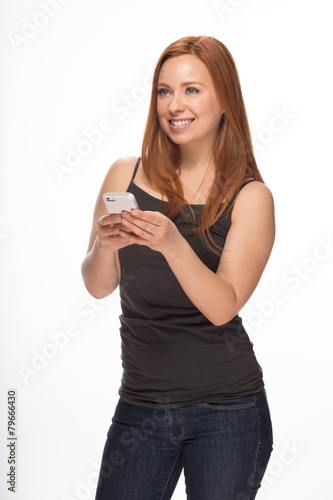 Young Caucasian woman texting on smart phone