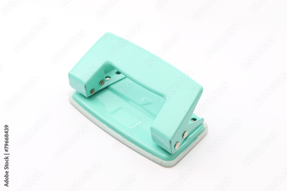 Hole puncher and blank paper on white Hole puncher and blank paper on white